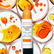 A bottle of 10% Waterless Vitamin C Serum with Vitamin C petri dishes behind it