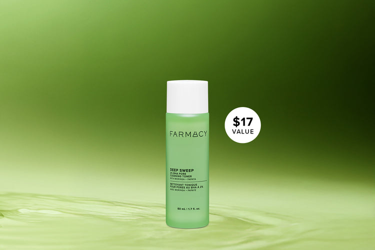 Green bottle of Farmacy Deep Sweep Toner with a white label on a green background