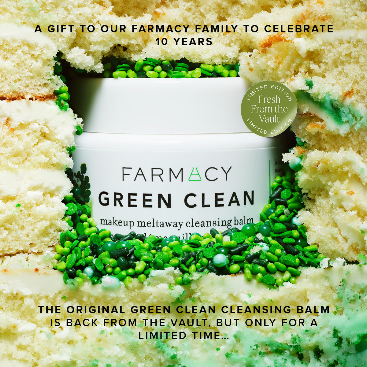 Farmacy Green Clean makeup meltaway cleansing balm surrounded by a decorative cake on a beige background to celebrate the brand anniversary 