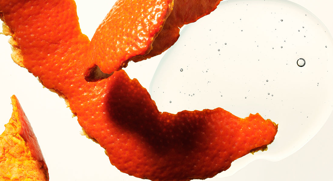 Close-up of orange peels on a white background