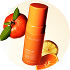 Orange juice being squeezed into a glass with an orange in the background