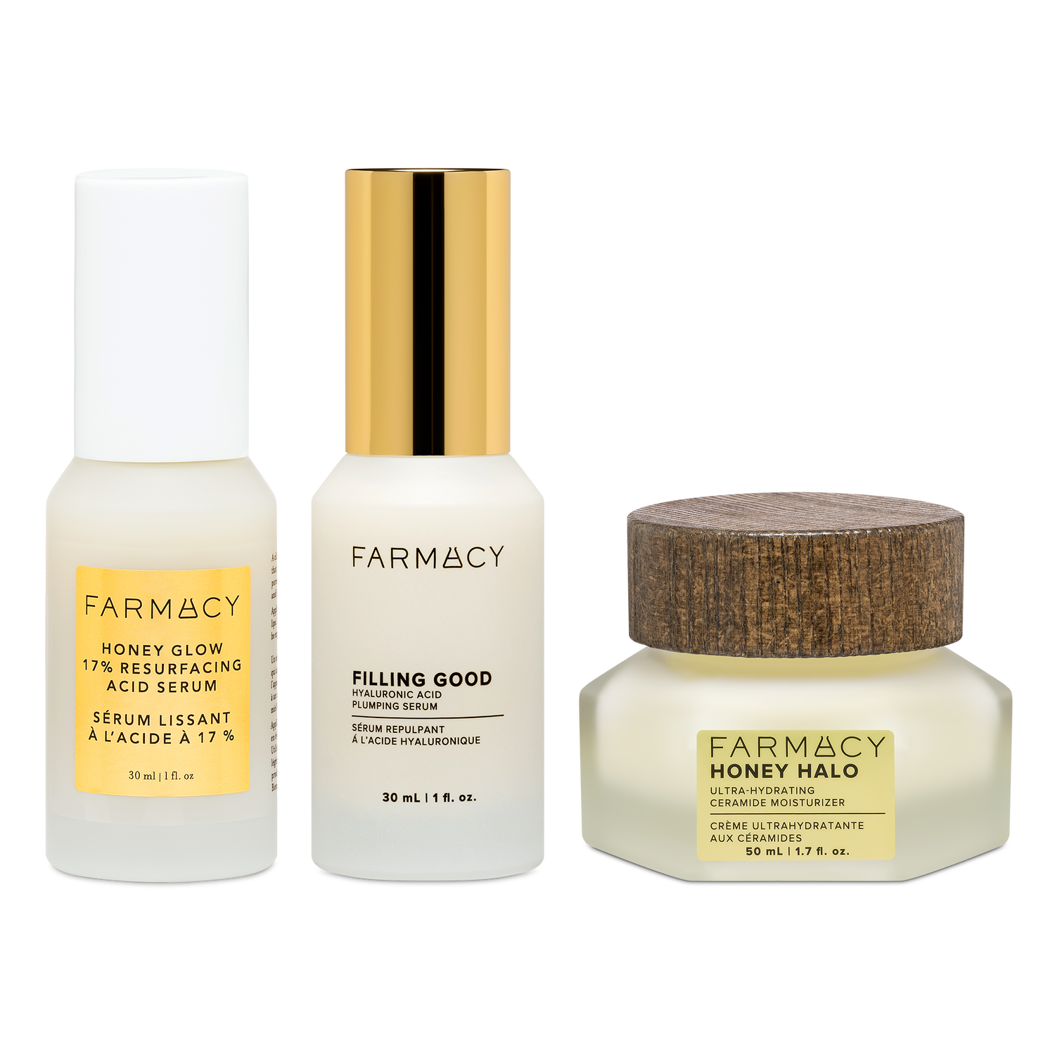 Farmacy Honey Glow Trio featuring Honey Glow Serum 30 mL, Filling Good Serum 30 mL and Honey Halo Moisturizer 50 mL on a white background