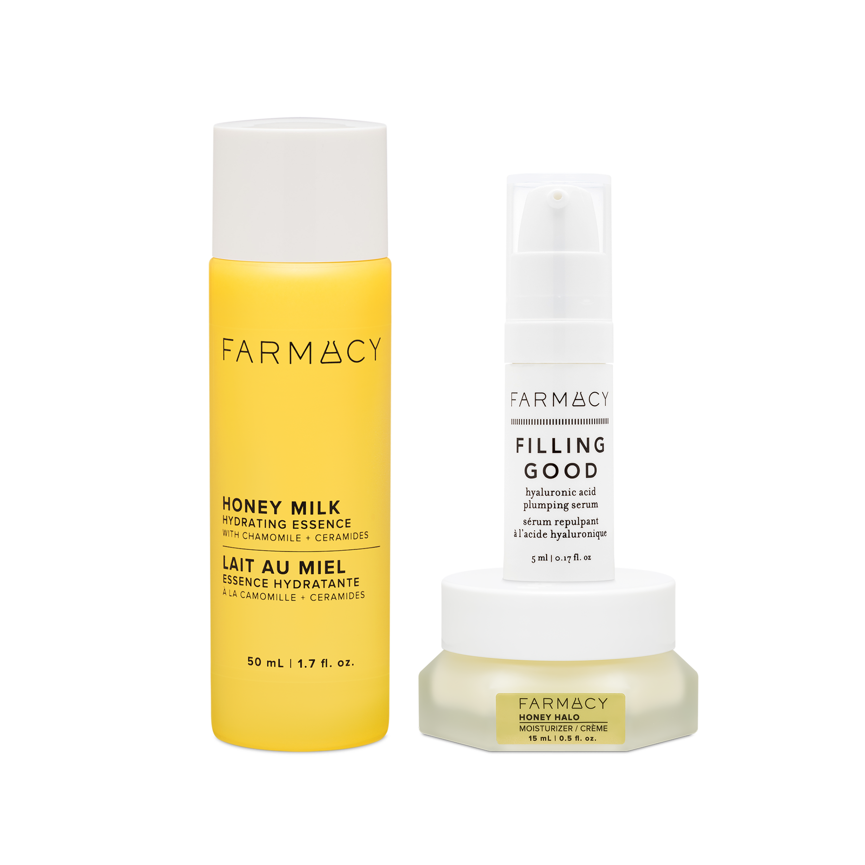 Farmacy Hydration Essentials Trio featuring Honey Milk Essence 50 mL, Honey Halo Moisturizer 15 mL and Filling Good Serum 5 mL on a white background