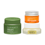 Three Farmacy skincare products arranged on a white background: a green jar of Green Clean Cleansing Balm 30ml, an orange jar of Mango Lip Smoothie 10g with a silver lid, and a white jar of Honey Halo Moisturizer  15mLwith a gold label.