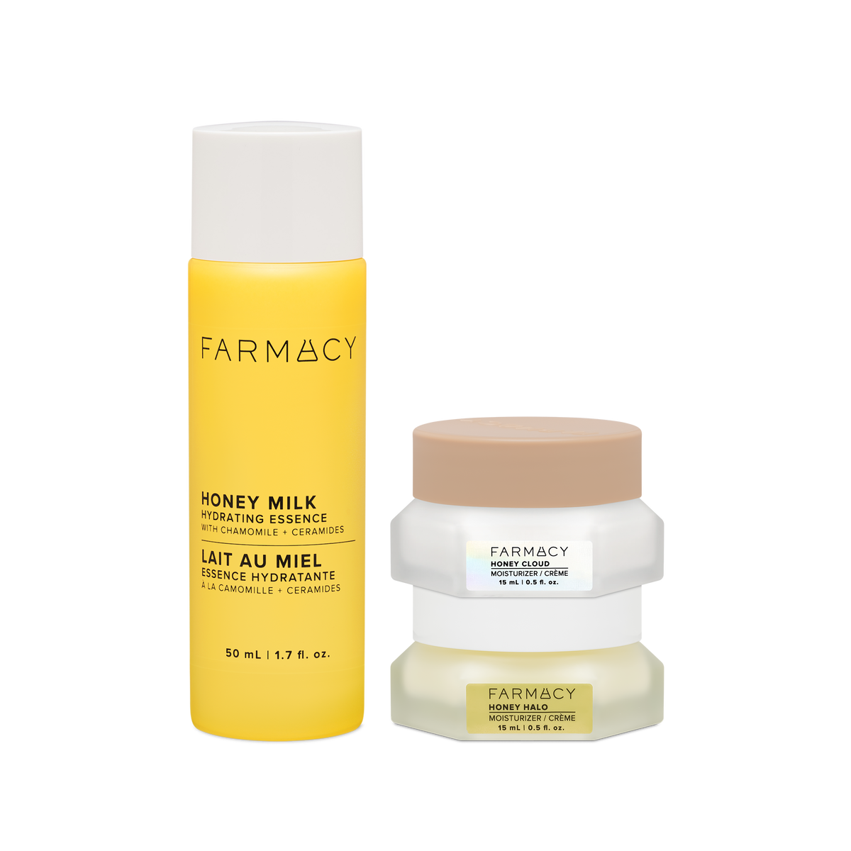 Farmacy Honey Barrier Trio featuring a 50 mL bottle of Honey Milk Hydrating Essence, a 15 mL jar of Honey Cloud Moisturizer and a 15 mL jar of Honey Halo Moisturizer on a white background