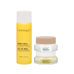 Farmacy Honey Barrier Trio featuring a 50 mL bottle of Honey Milk Hydrating Essence, a 15 mL jar of Honey Cloud Moisturizer and a 15 mL jar of Honey Halo Moisturizer on a white background