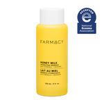 Yellow bottle of Farmacy Honey Milk Hydrating Essence on a white background with National Eczema Association acceptance badge