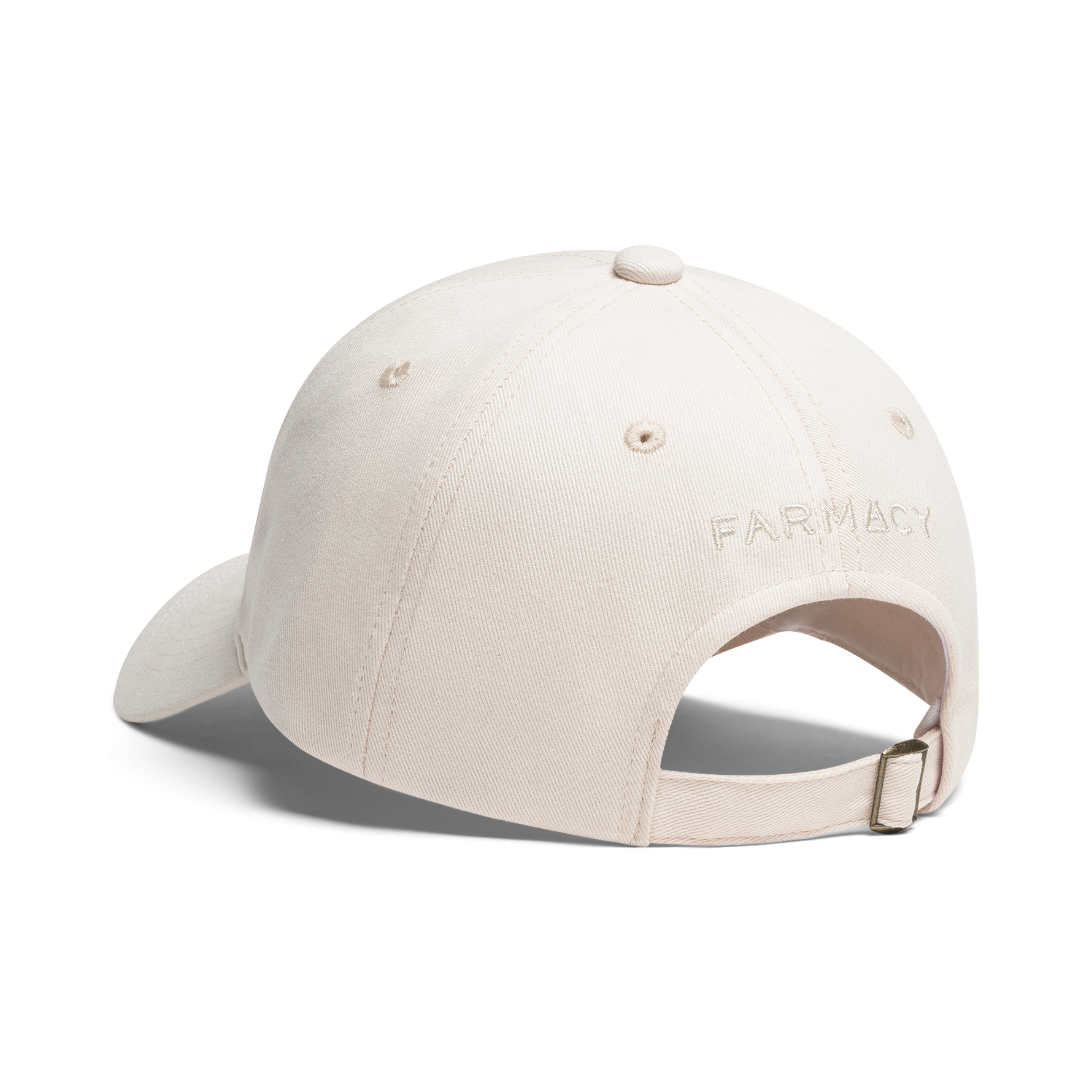 A light beige baseball cap shown from a rear three-quarter angle on a white background, featuring the word 'FARMACY' embroidered on the side and an adjustable strap at the back