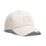A light beige baseball cap with 'HONEY, YOU'RE GLOWING,' embroidered on the front, shown against a plain white background