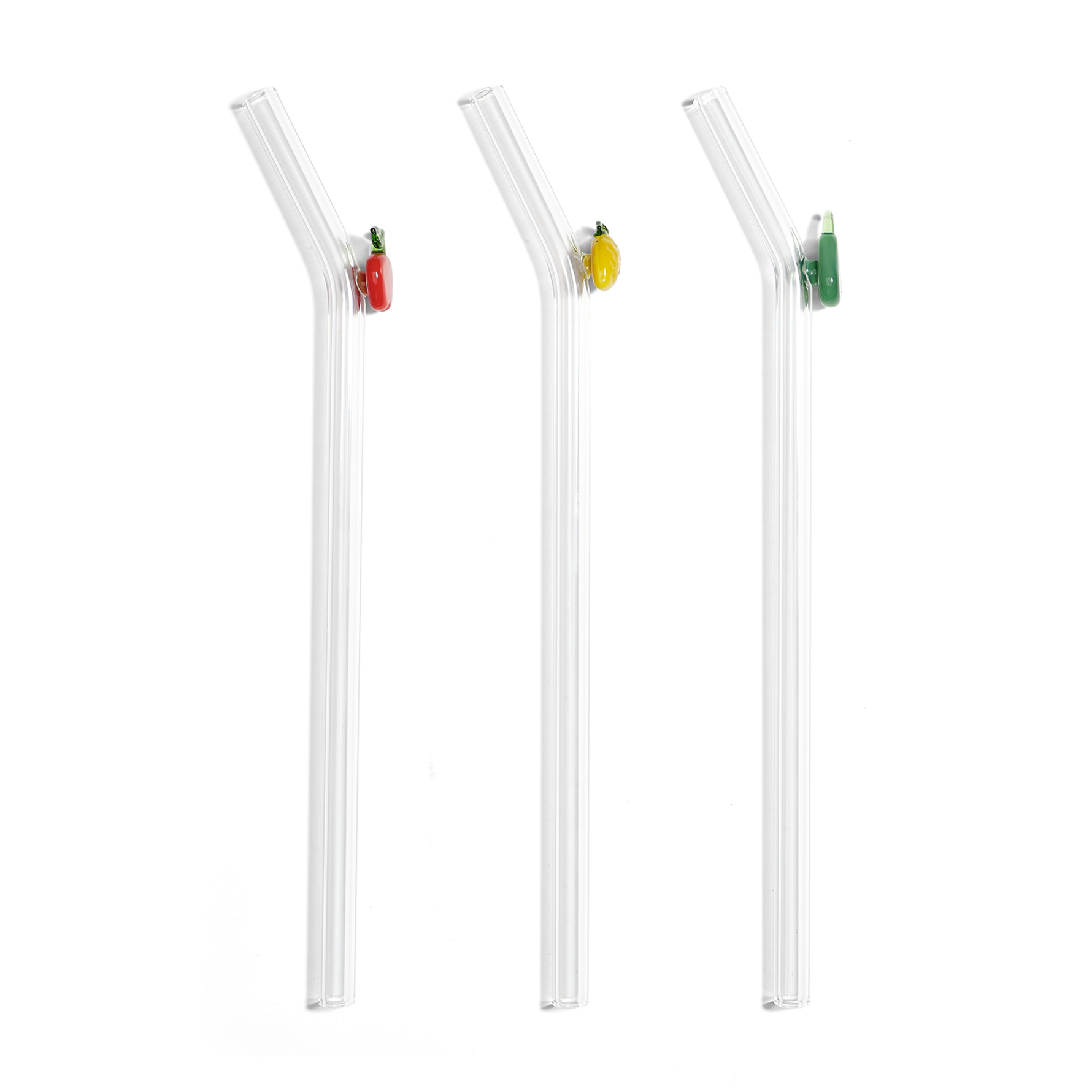 Three three reusable bent glass straws with colorful decorative charms on a white background