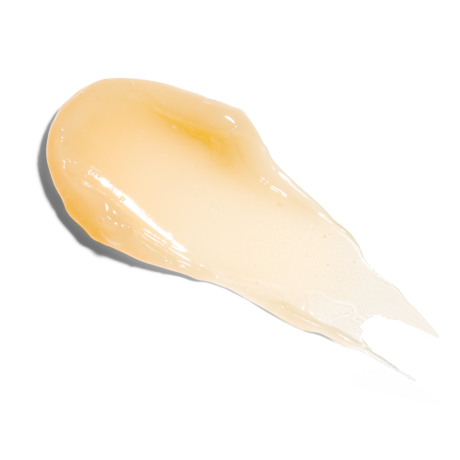 A glossy smear of Farmacy Mango Lip Smoothie on a white background