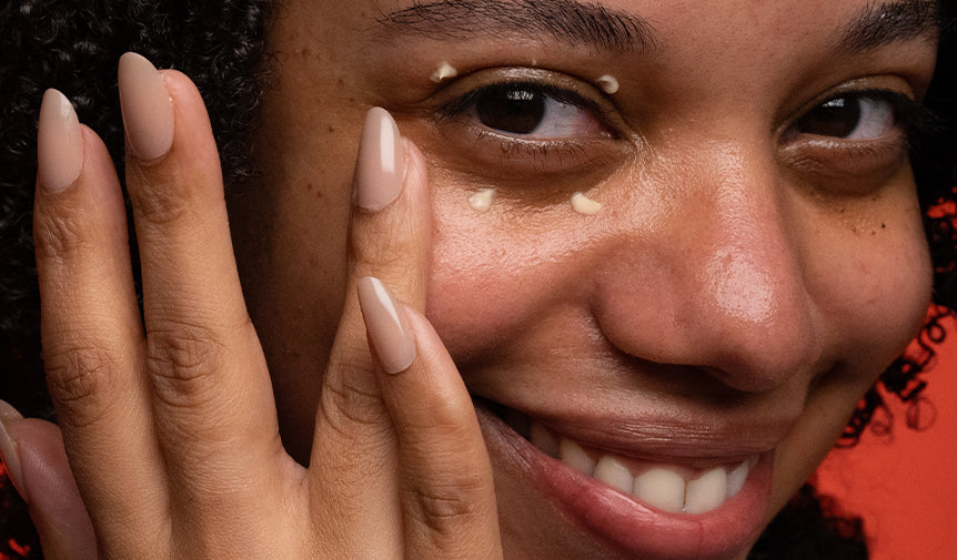 Model Applying Eye Cream