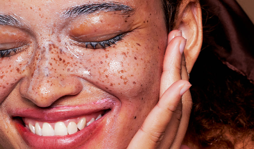 Woman washing her face