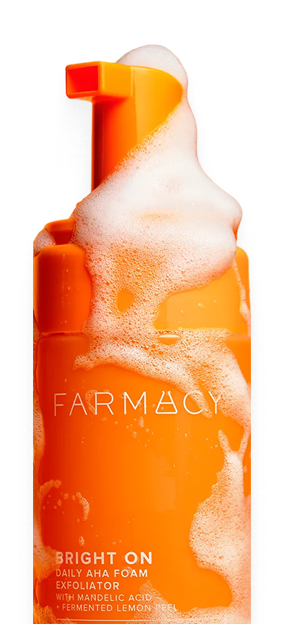 Farmacy skincare product with foam on a white background