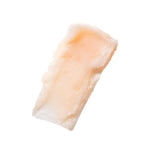 Peaches ’N Clean Makeup Meltaway Cleansing Balm smeared on a white surface 