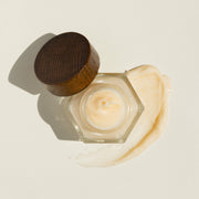 An aerial view of an open bottle of Farmacy's Honey Drop antioxidant-rich honey face moisturizer