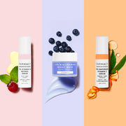 Three products next to each other, 1% Vitamin A Retinol Serum, 10% Niacinamide Night Mask, and 10% Waterless Vitamin C Serum on a tri colored background with fresh fruits and herbs 